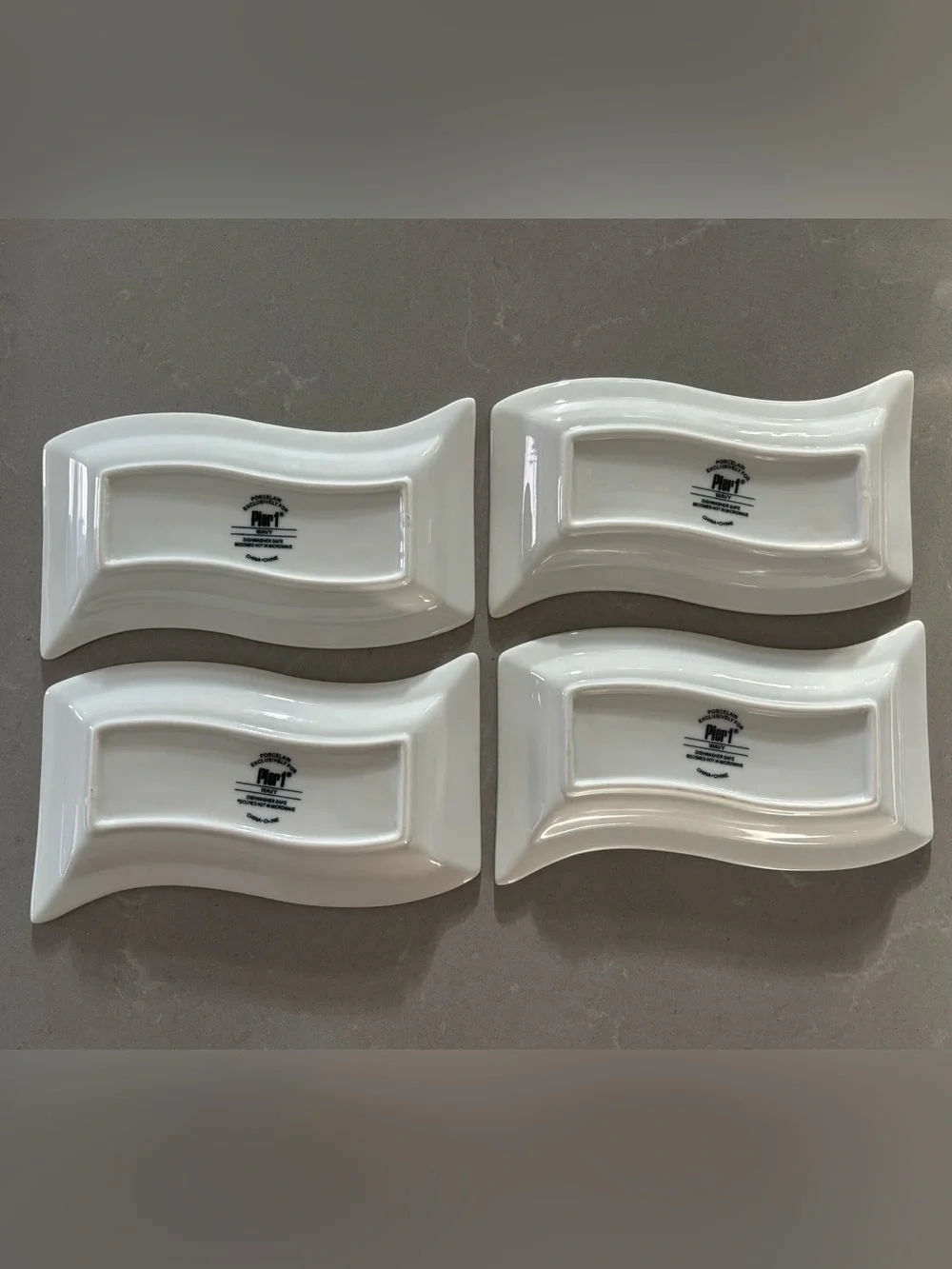 set of 4 Pier 1 Wavy white porcelain serving dishes